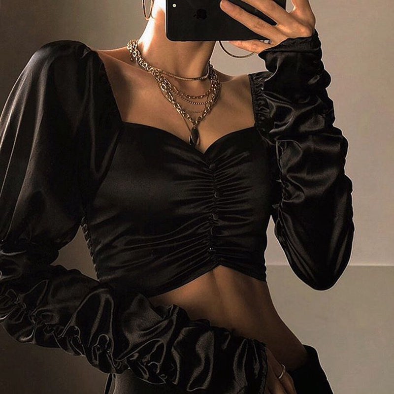 NOIRÉ | Top satinado elegante